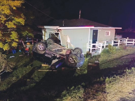 The vehicle was at a high enough rate of speed to crash through the roof of a home sitting downhill from the road.